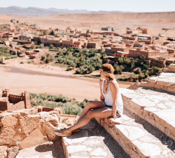 Woman enjoying view on steps, Ouarzazate, Souss-Massa-Draa, Morocco